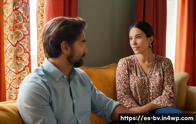 감정 이입을 통한 커뮤니케이션 개선 - A warm, intimate scene showing two diverse adults sitting in a cozy Spanish-style living room, engag...